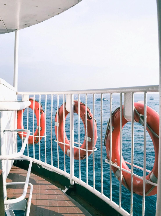 a number of life preservers hanging on the side of a ship