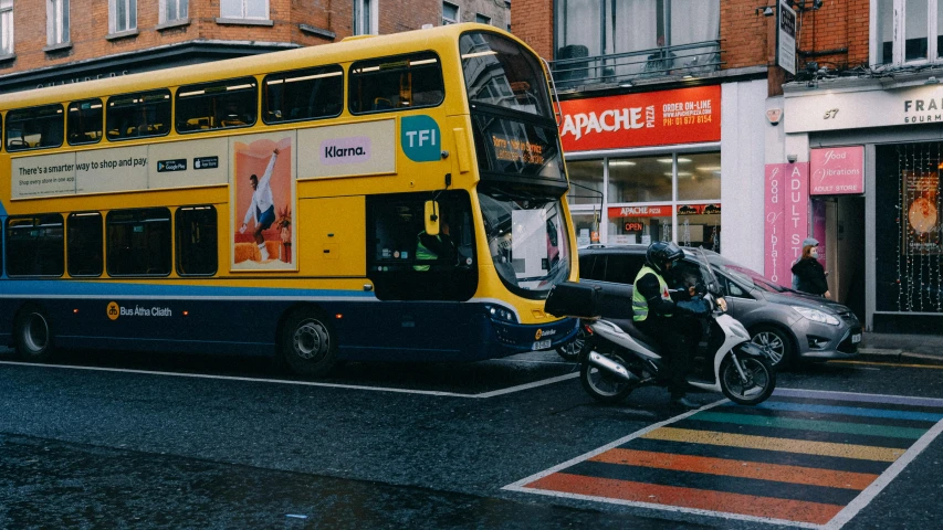 a double decker bus parked in front of a store