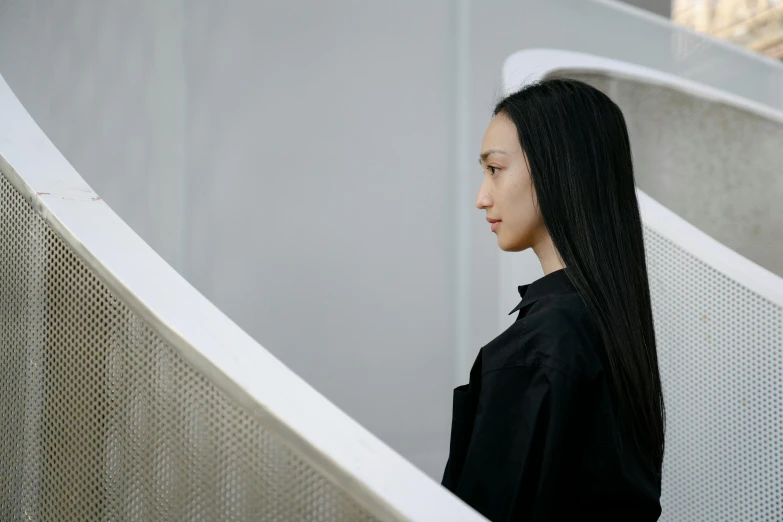 young woman walking on stairs in an empty building