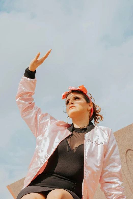 a woman in short shorts and an orange visor