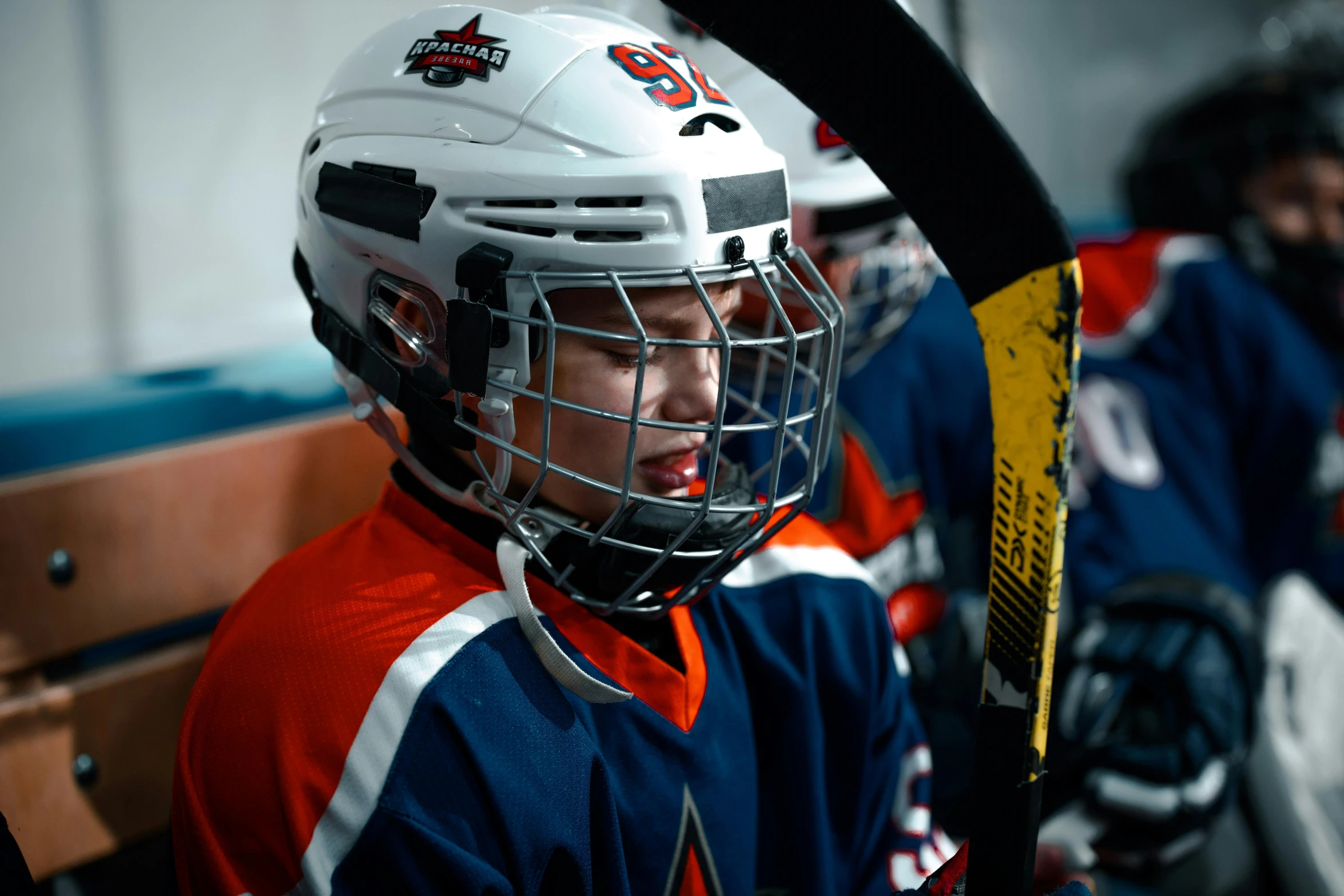 the young men are playing hockey together in a game