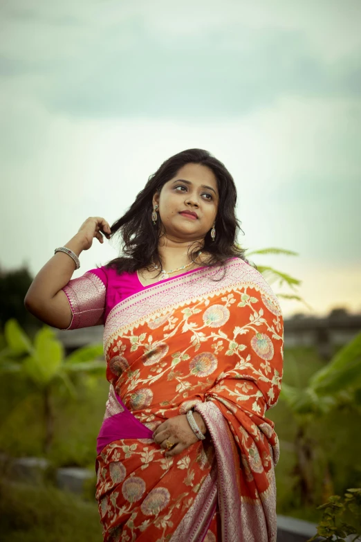 a woman standing with her arms on her shoulder