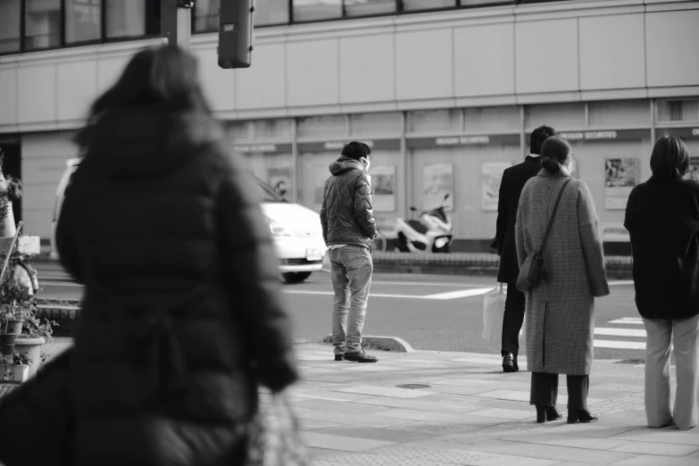 a bunch of people on a street corner