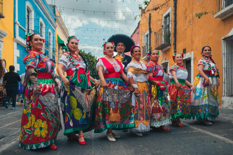 a group of women wearing mexican style costumes