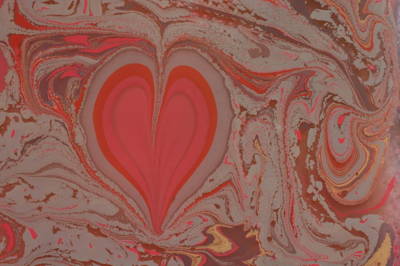 a red heart with gold swirls and gray and pink marbled