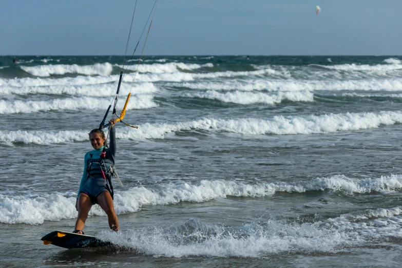 a person in the ocean with a para sail