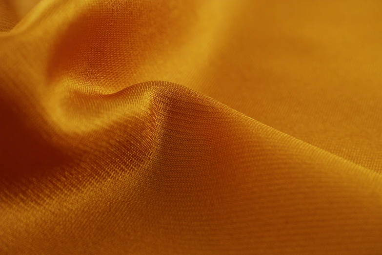 a cloth made of gold silk that is silky and smooth