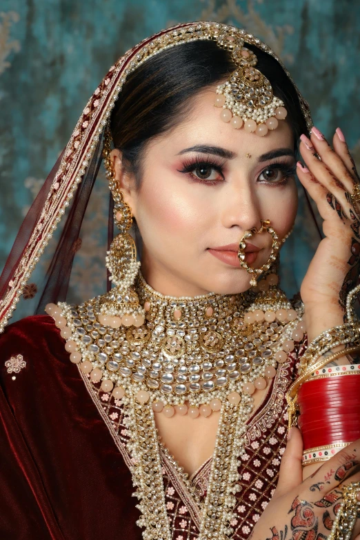 a woman dressed in gold with heavy jewelry