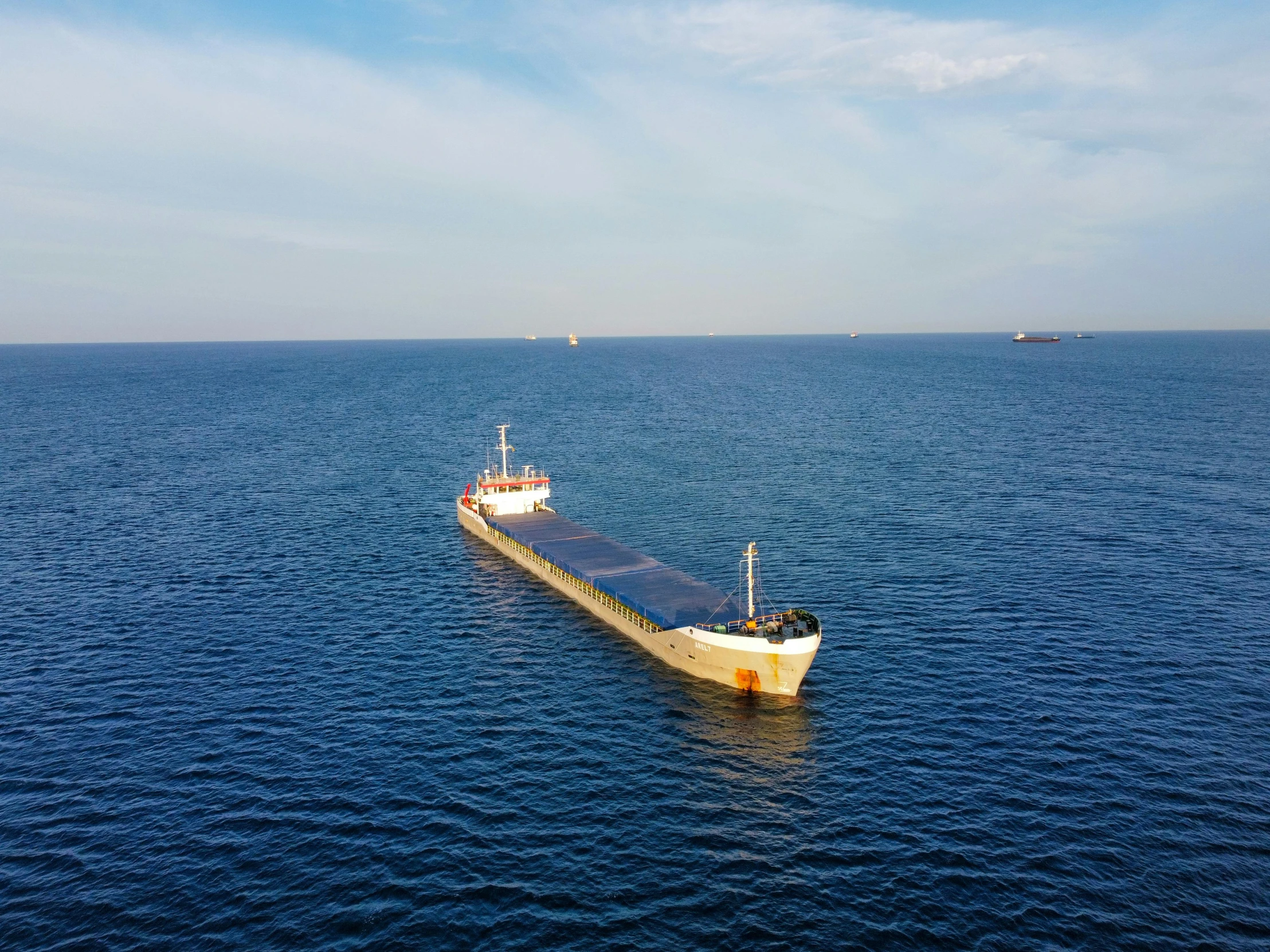 a large ship floating in the middle of the ocean