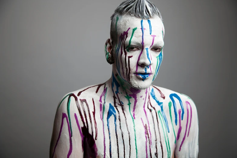 a man is posing with his body painted all over