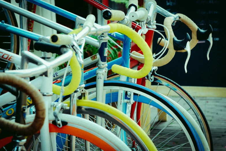 a row of brightly colored bicycles in front of a store