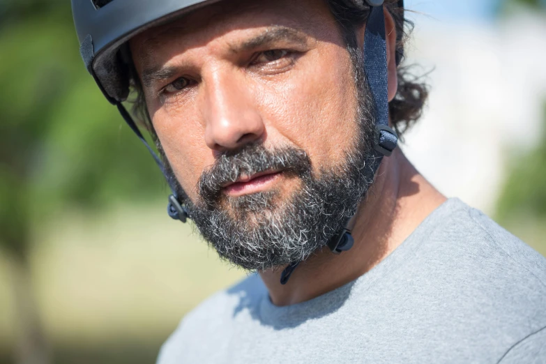 a close up po of a man wearing a helmet