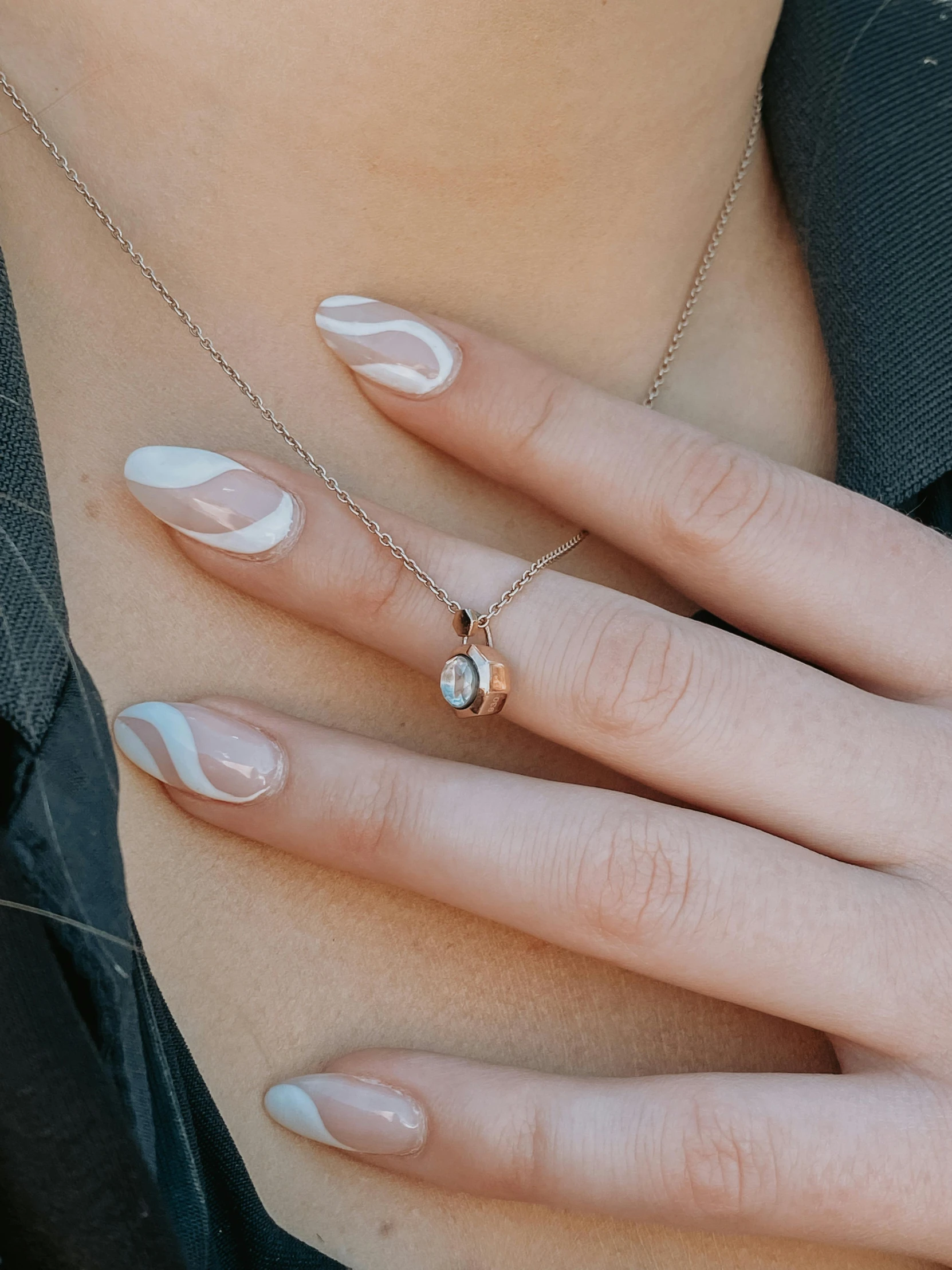 a woman with white fingernails and a white manicure