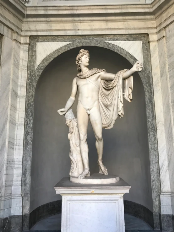 a statue is shown in an ornate archway