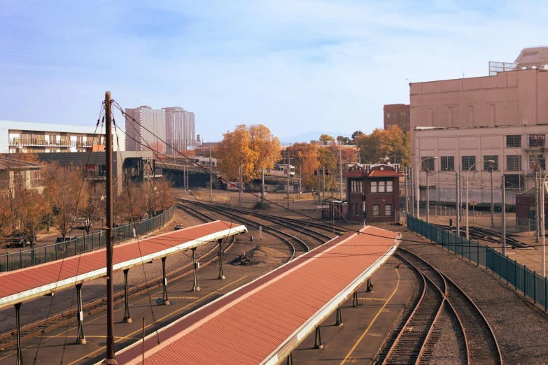 there is an image of a train coming out the middle of the tracks