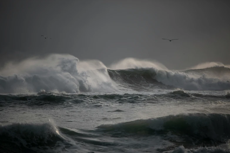 the sea is dark and gray during the daytime