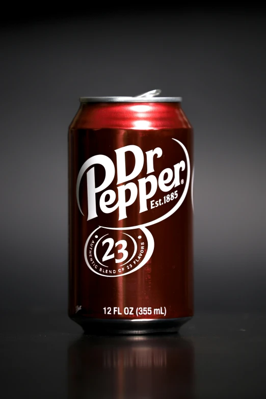 an opened can of drink that says pdd pepper