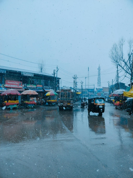 a wet road in a village during a rain storm