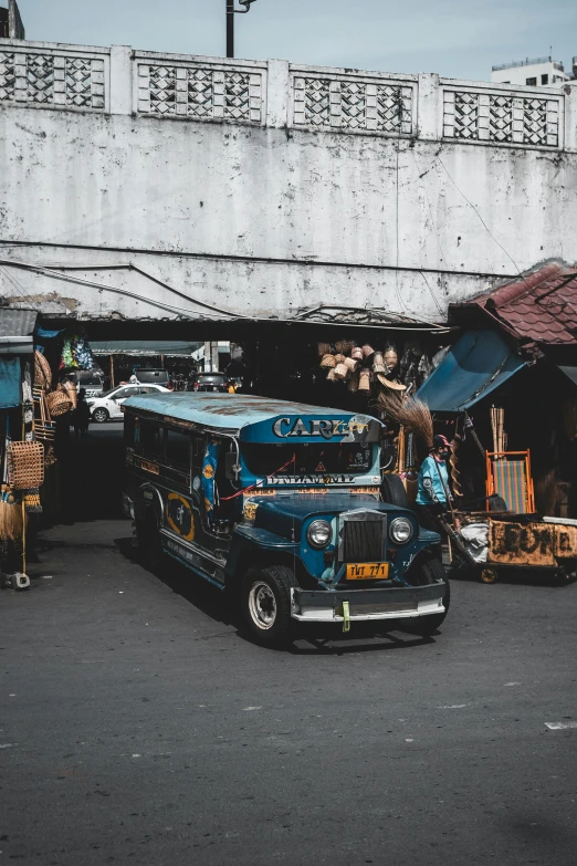 a bus parked on the street in front of a building