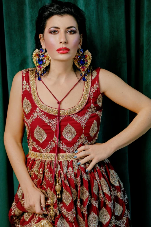 a woman is wearing an ethnic looking costume