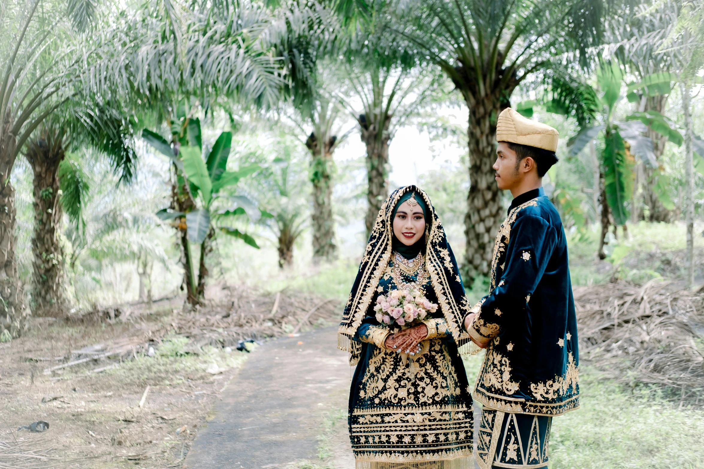 an indian couple in traditional attire walking down the road