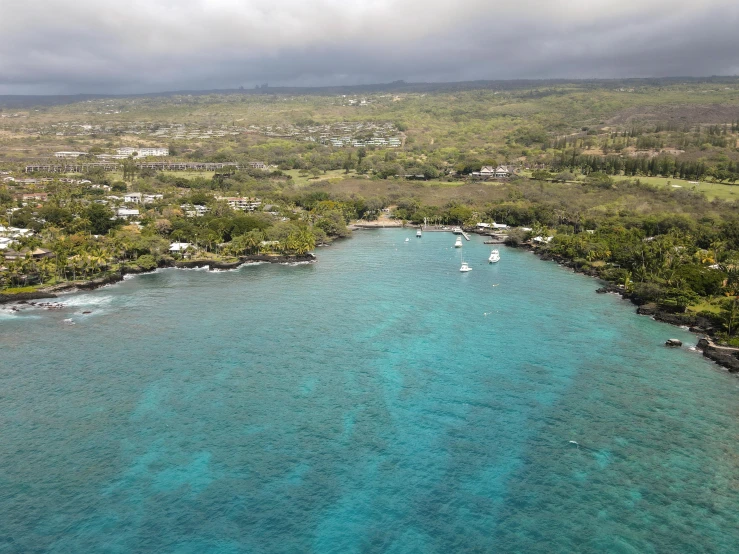 a small island is located in the middle of blue water