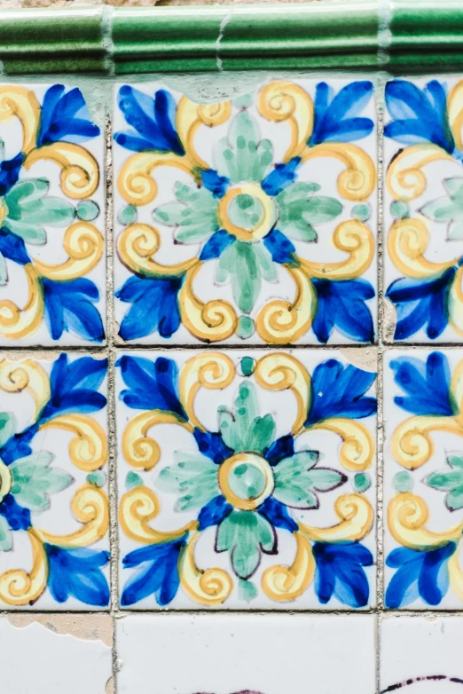 colorful tiles painted on the wall in a pattern