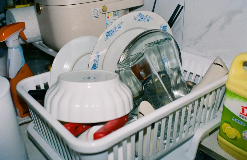 kitchen appliances are piled next to a washer