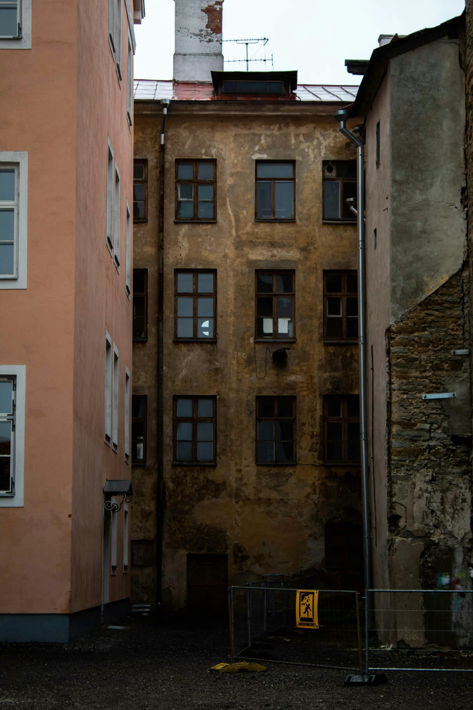 two brick buildings on either side of a street