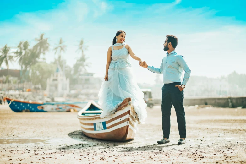 a bride and groom standing on a boat that is made to look like a boat