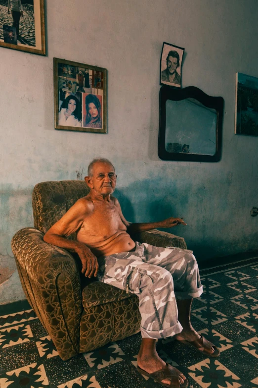 a man sits in a chair in a room