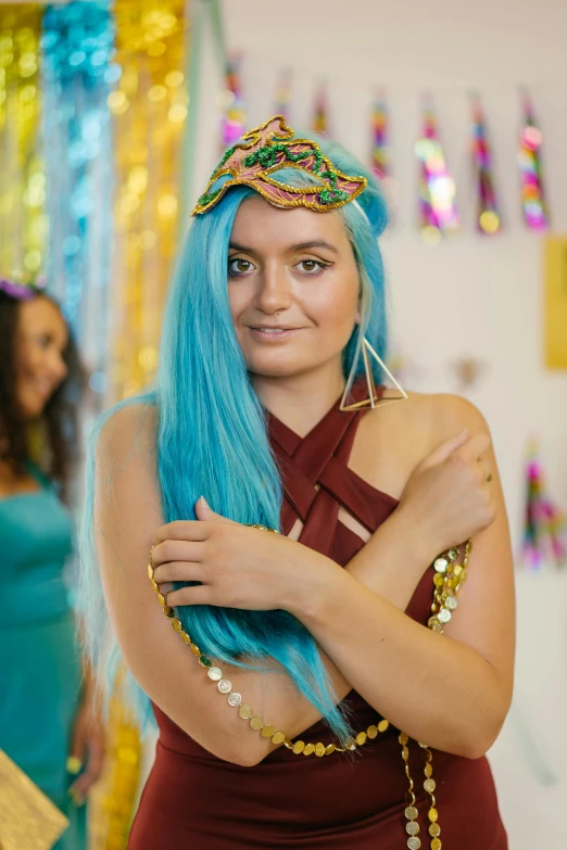 a girl wearing a blue wig with multicolor hair and a headband