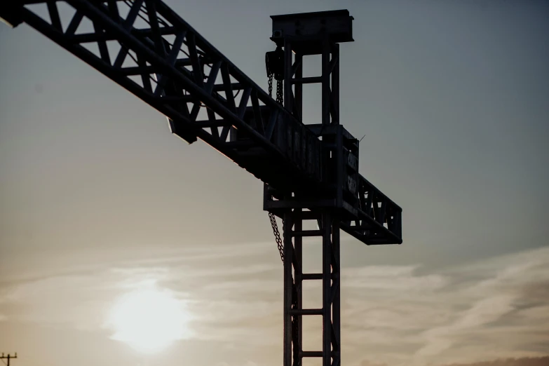 a man rides a skateboard on top of a large structure