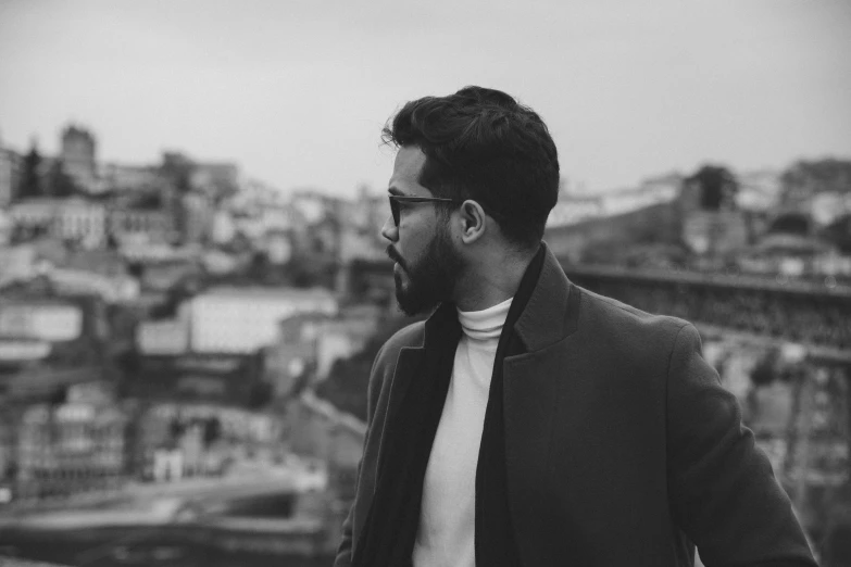 a man is standing on a roof with buildings in the background