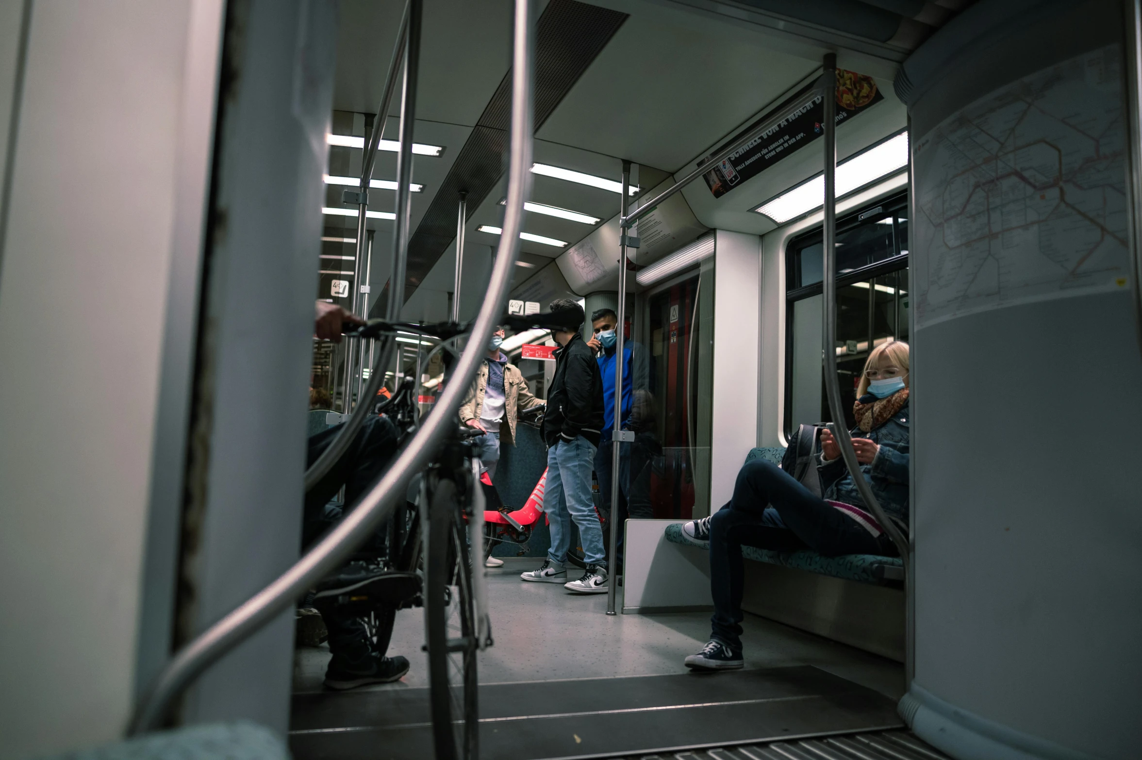 a bunch of people who are riding on a train