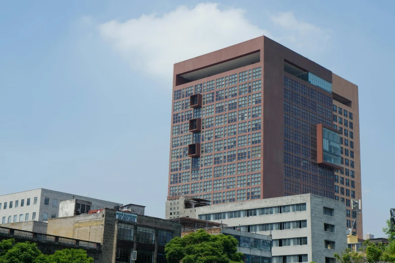 the tall building is very large and red