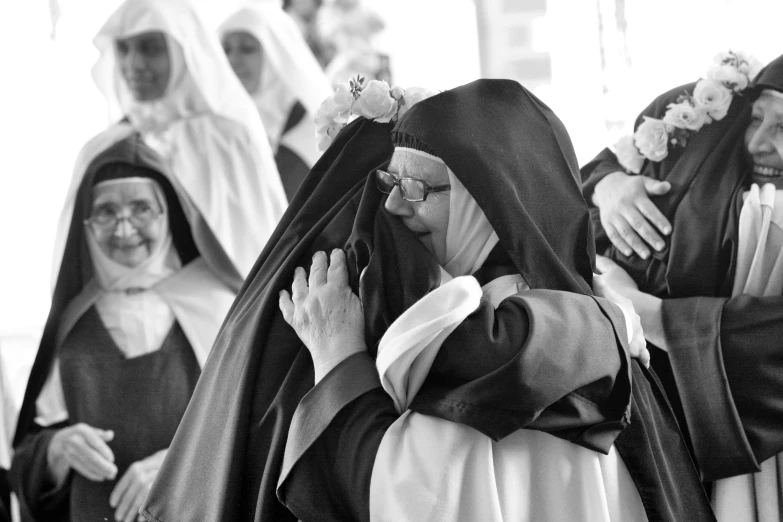 a black and white po of some people wearing religious costumes