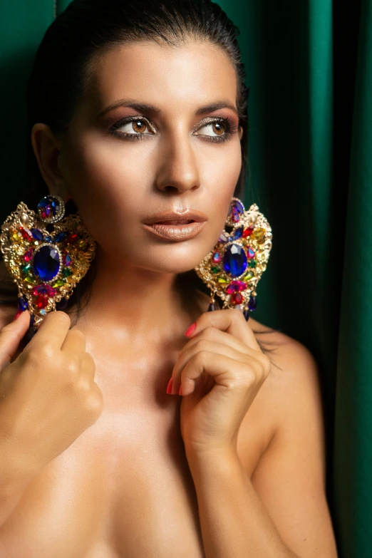 a woman with an elegant statement earrings and makeup
