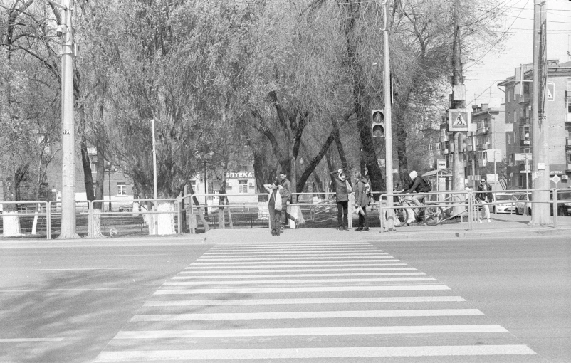 a black and white po of the cross walk at an intersection