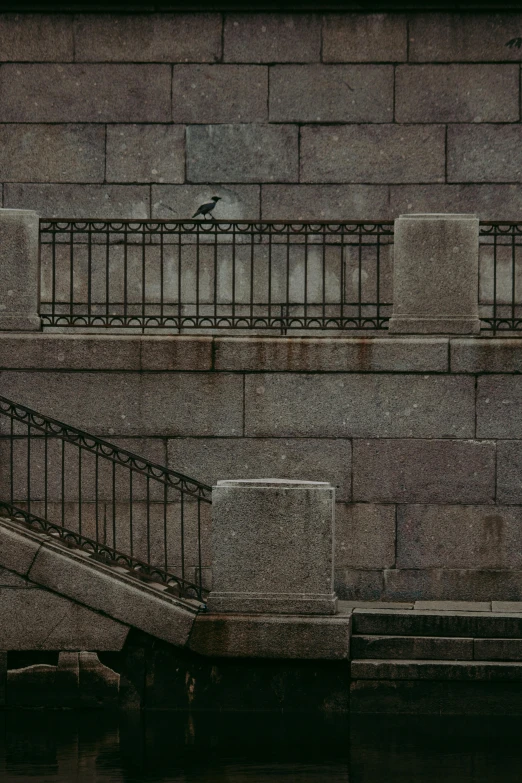 a man riding a skateboard down the side of a concrete staircase