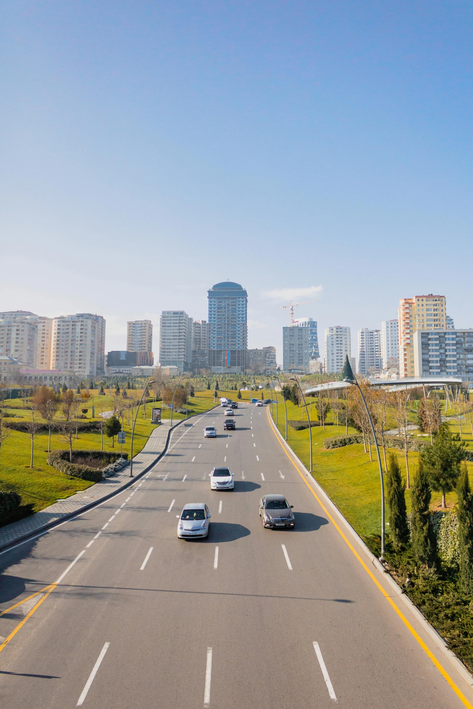 a highway leads down to some very high rise buildings