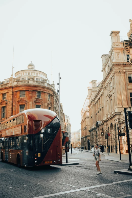 a double decker bus traveling down a quiet street