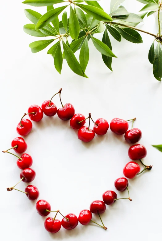 a cherry heart made up of fresh cherries