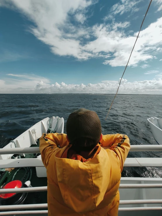 a person on the back of a boat in the water