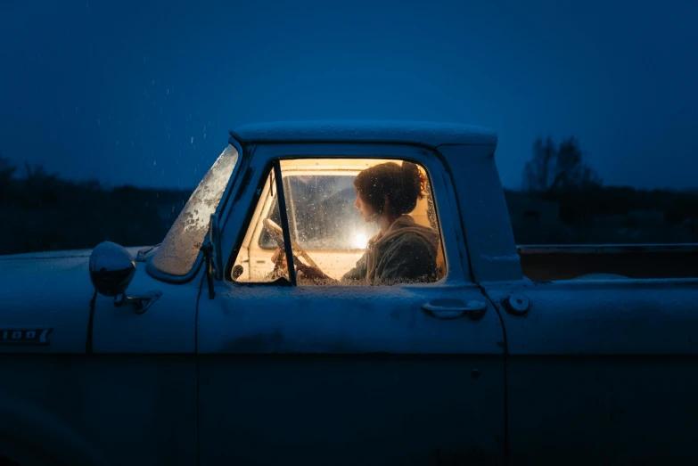 a person in the window of a truck