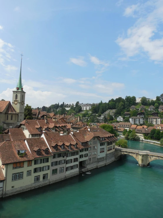 some buildings next to a very large bridge