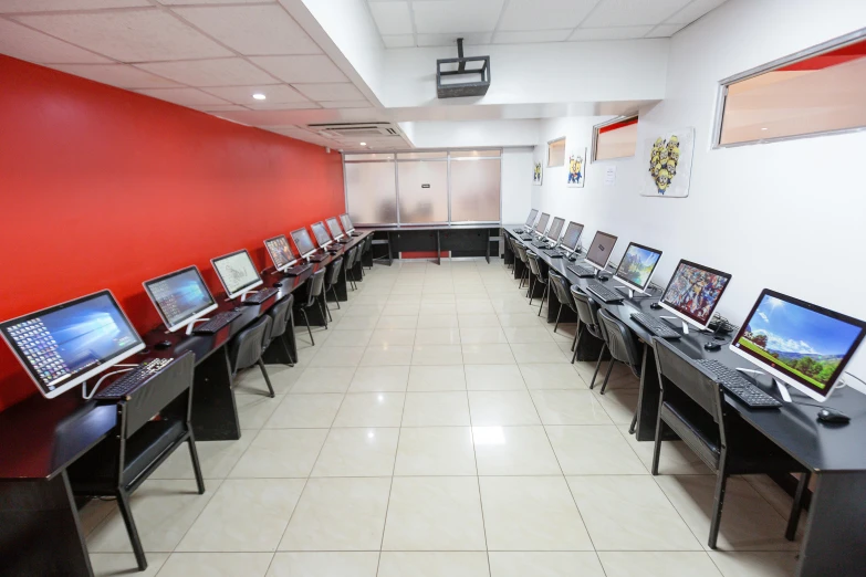 tables with computers and pictures displayed on them