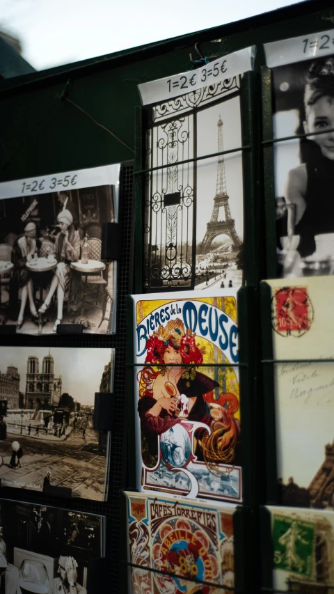 vintage pos and posters are lined up on the wall