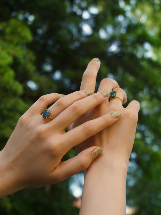 a couple of people with ring rings on their fingers