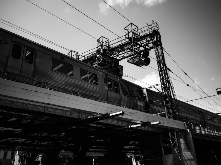 the train is going through the station in black and white